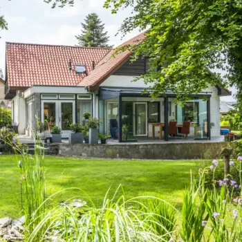 Stylish Pigato veranda with integrated gutter options by Designer Verandas